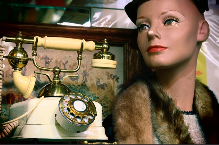 vintage phone and mannequin