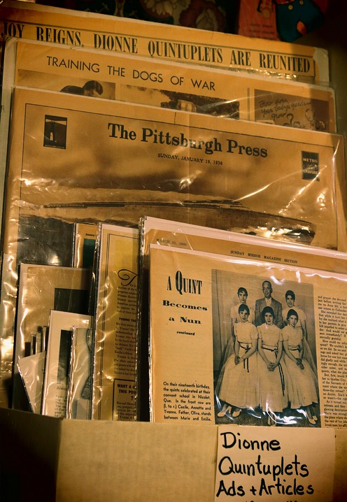 old yellow newspapers ads and articles about the dionne quintuplets