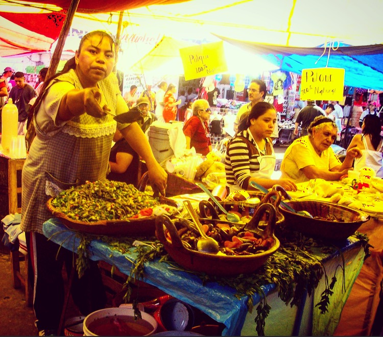 colorful & flavorful fruit, vegetable, and sauce stands at the market
