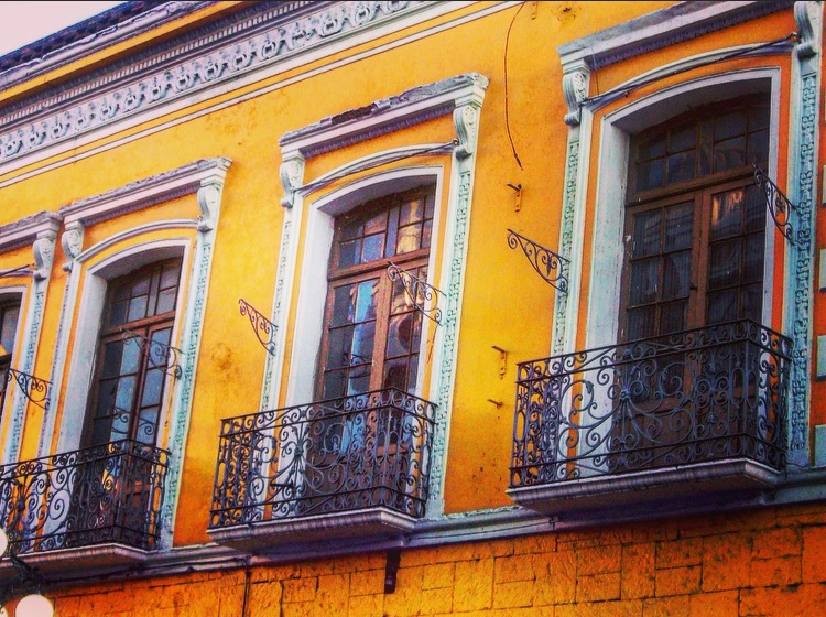 colorful decorative windows and building design in Puebla, Mexico