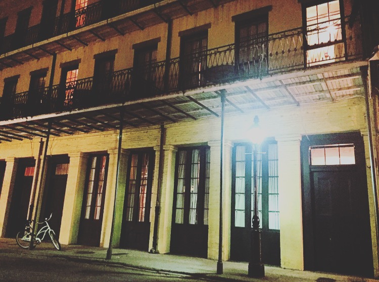 yellow building, night street scene of New Orleans
