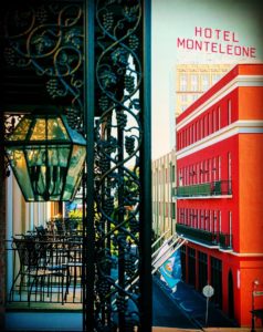 view of Hotel Monteleone sign from balcony new orleans French Quarter wrought iron details