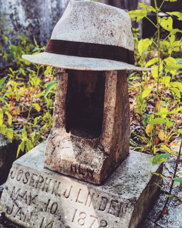 hat on a tombstone in Lafayette Cemetery, New Orleans