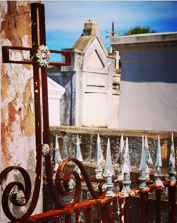 wrought iron cross and gate in New Orleans cemetery