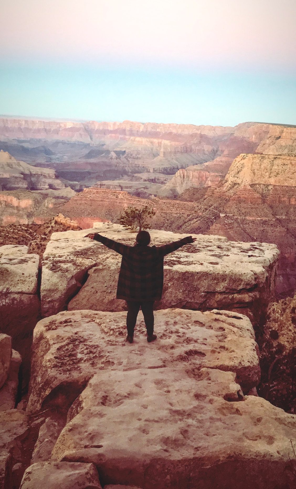 Yanis Carreto, author, Hopeless Nostalgic standing in the Grand Canyon