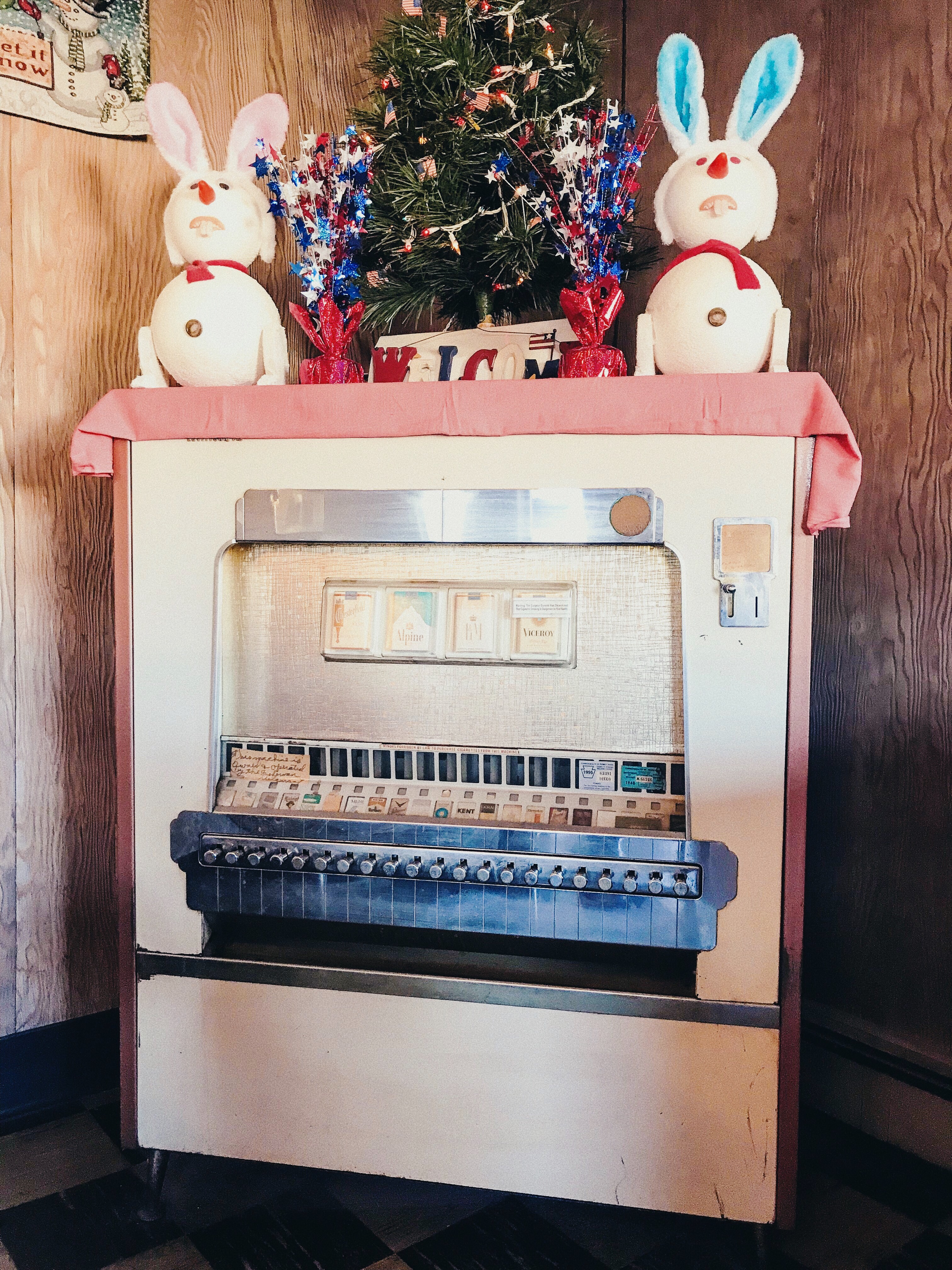 Vintage cigarette machine and decorations in The Fisherman Restaurant, Phoenixville, Pennsylvania