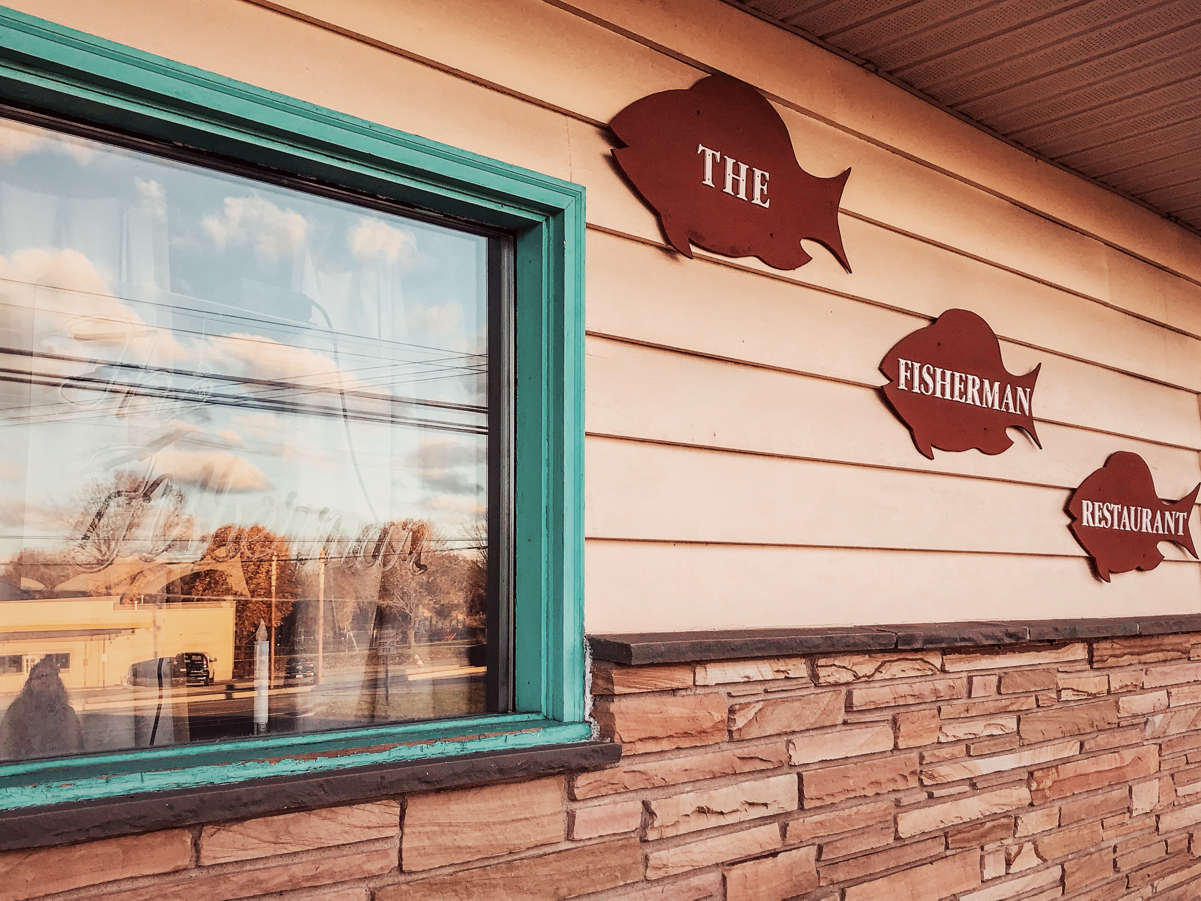 The Fisherman Restaurant fish signs on the exterior of The Fisherman Restaurant, Phoenixville, Pennsylvania