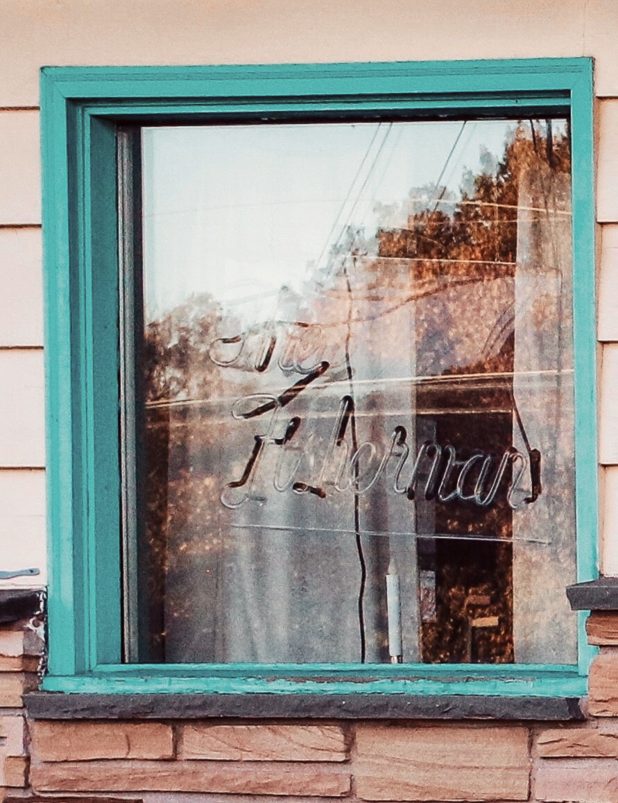 Neon sign in the window of The Fisherman Restaurant in Phoenixville, Pennsylvania 