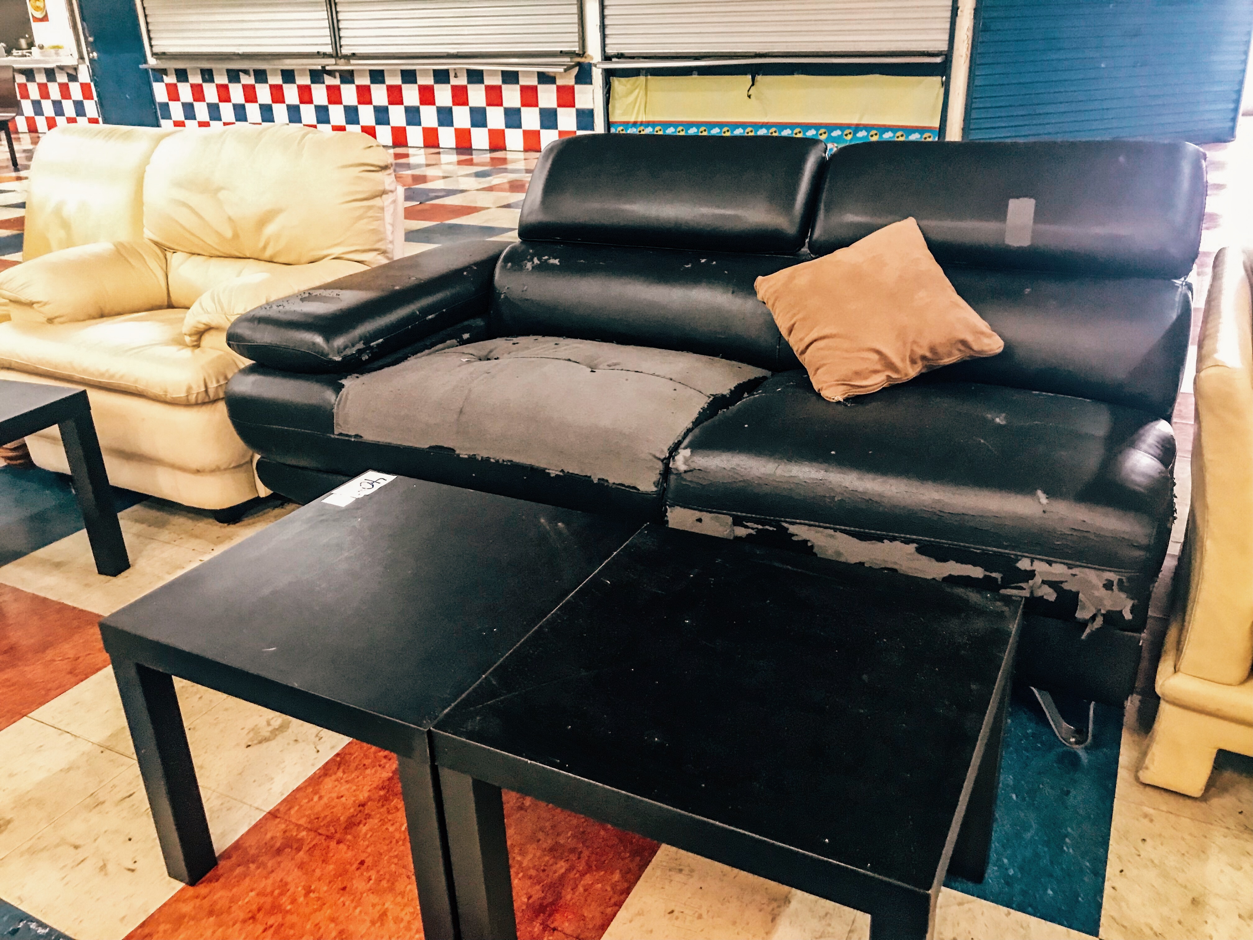 Flea Market USA, Miami, FL worn and torn couches