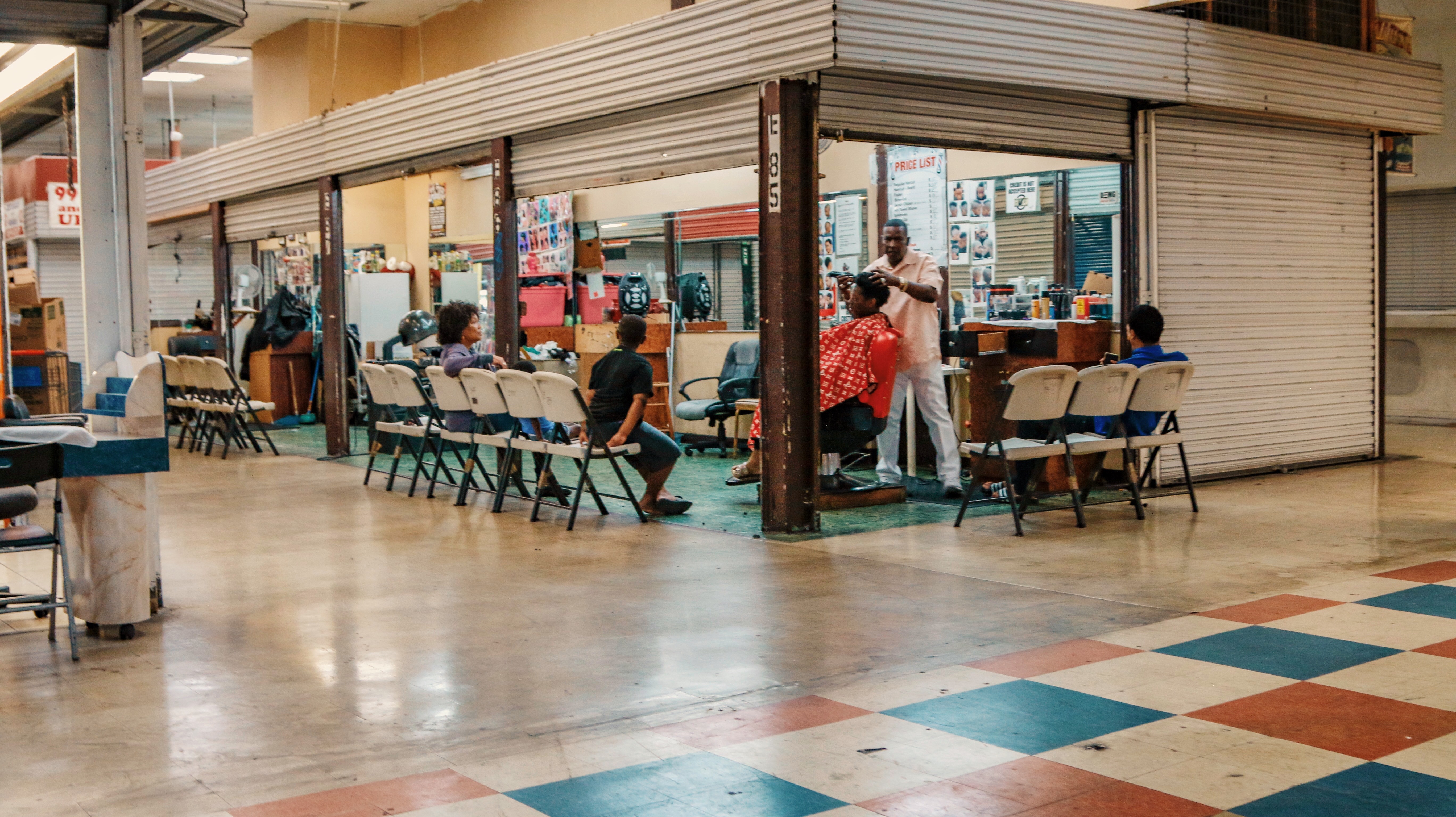 Busy barber shop at Flea Market USA, Miami, FL