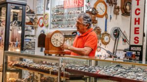 Fixing a clock at Ramon's Jewelry shop, Flea Market USA, Miami, FL