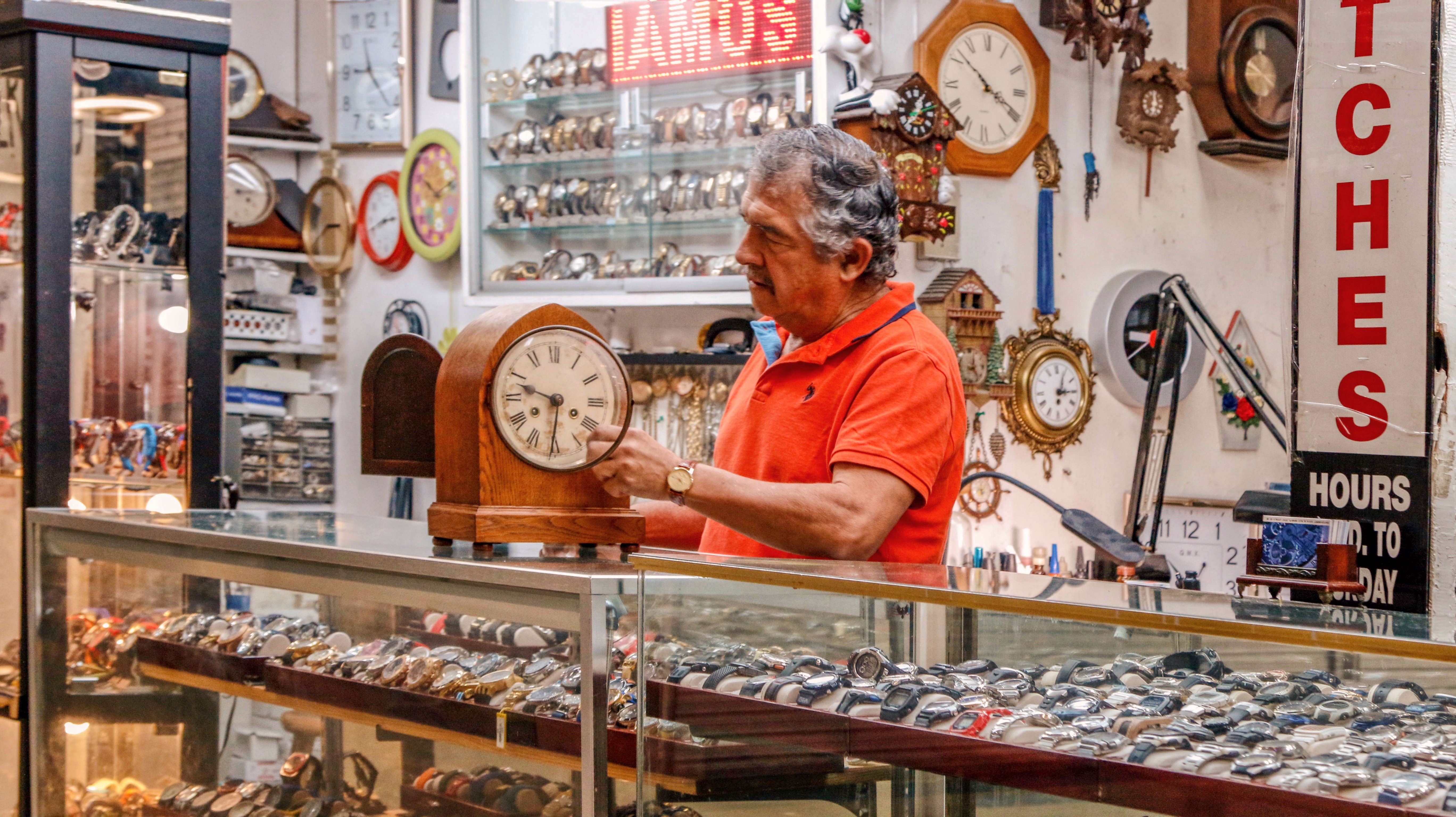 Fixing a clock at Ramon's Jewelry Shop Flea Market USA, Miami, Fl