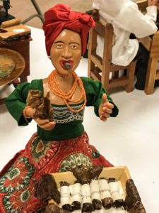 Woman with traditional Cuban dress and cigars