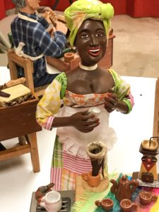 Woman with traditional Cuban dress with Café