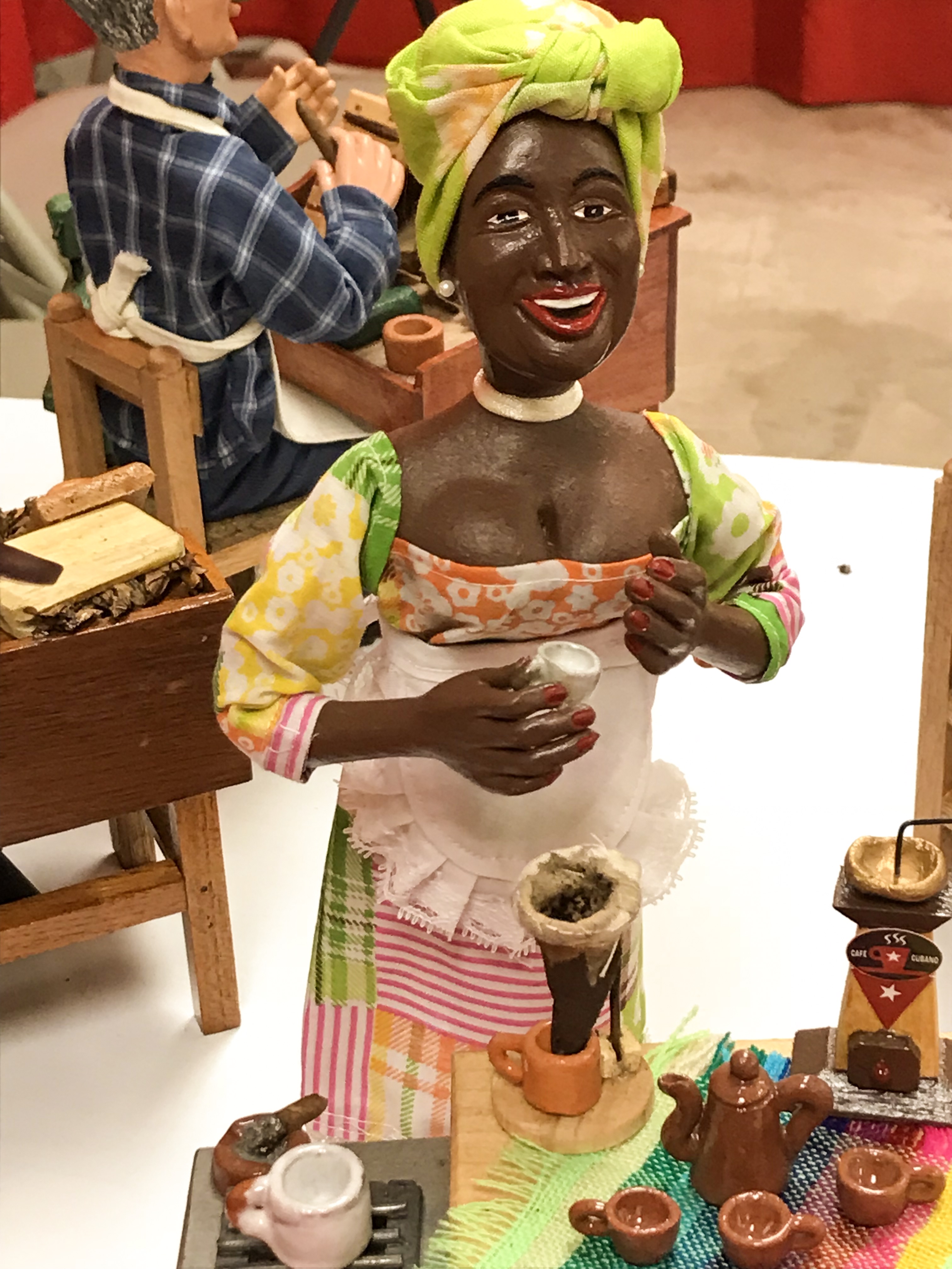 Woman with traditional Cuban dress with Café