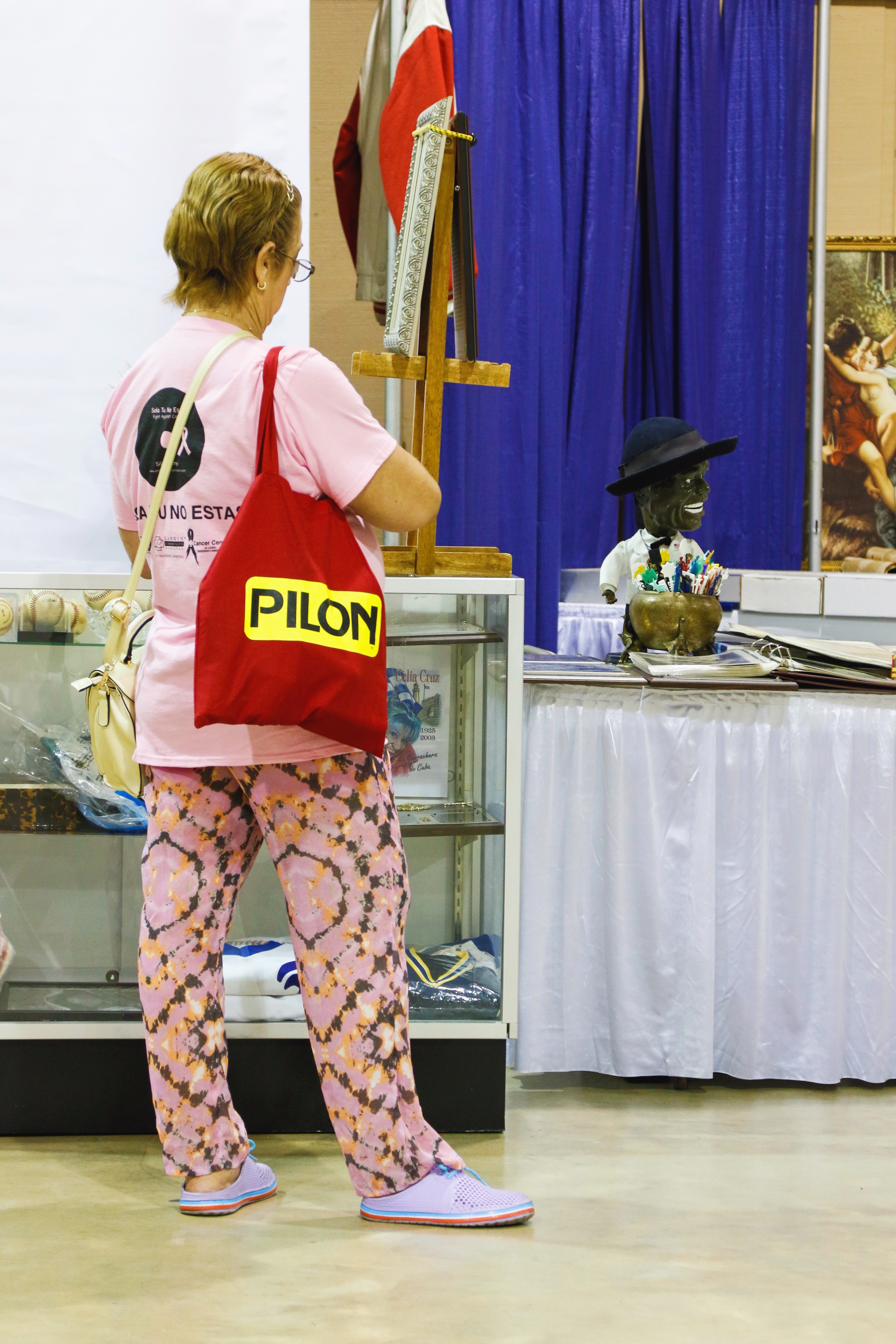 Woman with Café Pilon bag